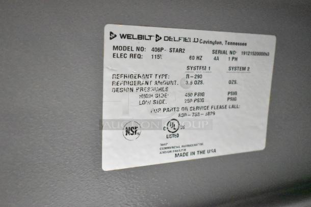 Label on Delfield 406P-STAR2 cooler showing model, electrical requirements, refrigerant type, and pressure details.