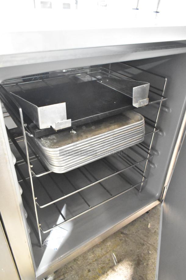 2021 Delfield 406P-STAR4 single door undercounter cooler with commercial casters, shelving, 115V, good condition.