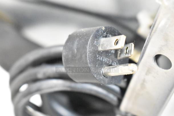 Close-up of the power plug for a 2021 Delfield 406P-STAR4 commercial cooler, showing standard 115V connector.