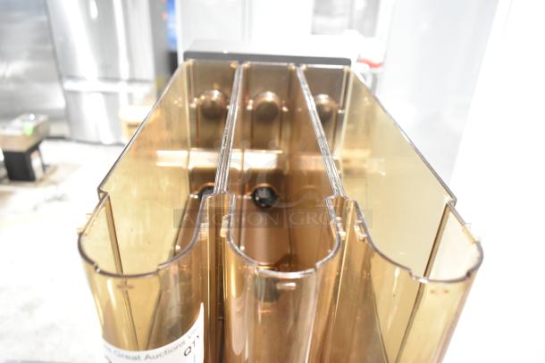 Commercial countertop coffee tower machine with multiple compartments, good condition, visible auction label.