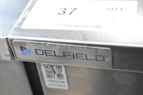 2019 Delfield 406P-STAR2 undercounter cooler, single door, 115V, 1 phase. Features Delfield branding label.