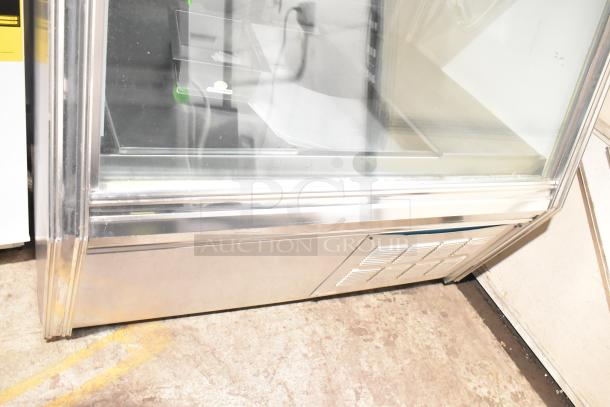 Leader Commercial Floor Style Deli Display Case, 115 Volts, 1 Phase. Features glass front and metal exterior. Excellent condition.