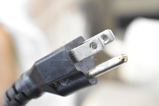 Close-up of a power plug for the BRAND NEW Avantco 178SSUC60RHC commercial cooler, indicating 115 volts, 1 phase.