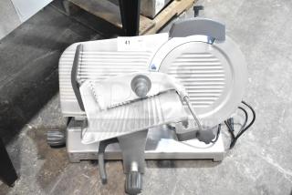 BRAND NEW Hobart EDGE14-11 manual meat slicer, 14" blade, countertop model, with blade sharpener. Scratch and dent condition.