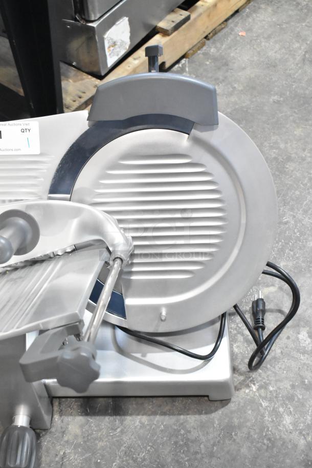 BRAND NEW Hobart EDGE14-11, 14" manual meat slicer, includes blade sharpener. 115V, 1 Phase. Visible scratch and dent.
