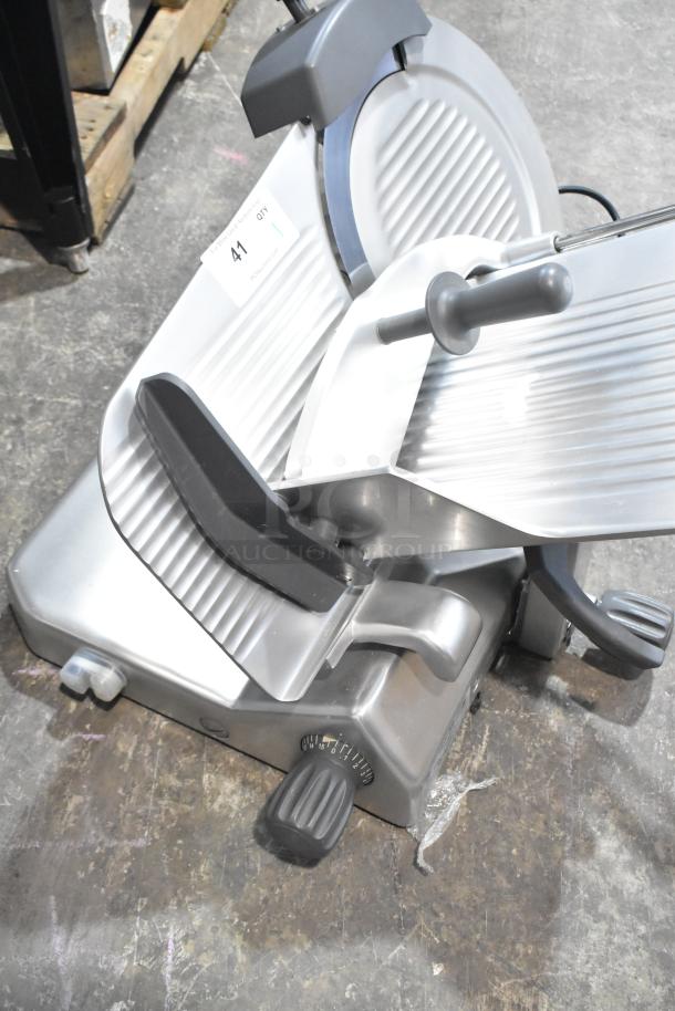 BRAND NEW Hobart EDGE14-11 meat slicer with 14" blade, built-in sharpener. Scratch and dent condition. Commercial countertop model.