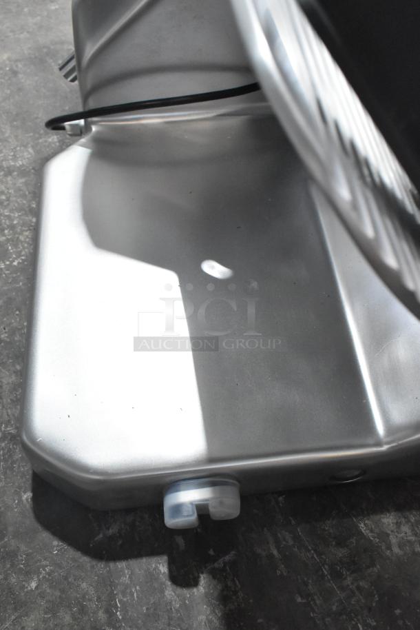 Brand new Hobart EDGE14-11 commercial meat slicer, 14" manual, with blade sharpener, 115V, 1 phase, slight cosmetic dent.