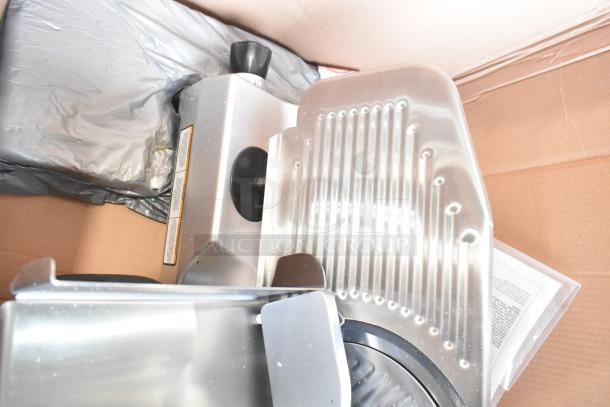 Brand new Pro-cut KDS-10-DC commercial meat slicer with 14" blade, scratch and dent condition. Includes blade sharpener.