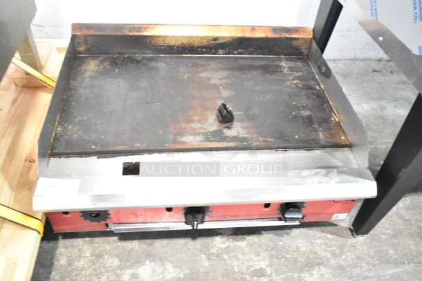 2025 Avantco 177CAG36TG countertop gas griddle, used. Sturdy flat top with visible wear, dual control knobs, and metal front.