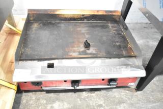 2025 Avantco 177CAG36TG countertop gas griddle, used. Sturdy flat top with visible wear, dual control knobs, and metal front.