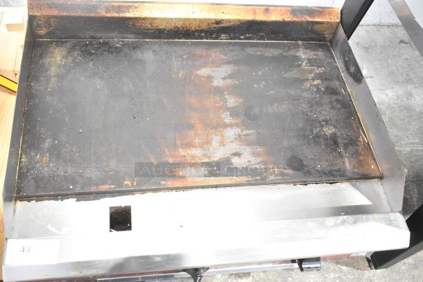 2025 Avantco 177CAG36TG Commercial Gas Griddle; used condition, visible surface wear, stainless steel construction.