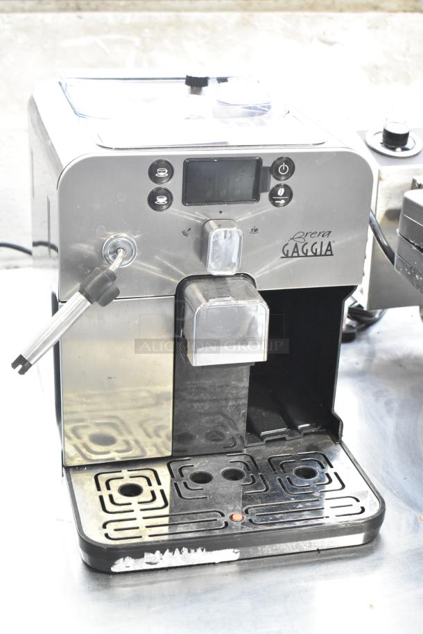 Gaggia Brera super-automatic espresso machine, stainless steel finish, countertop model, 115 volts, visible wear, labeled controls.
