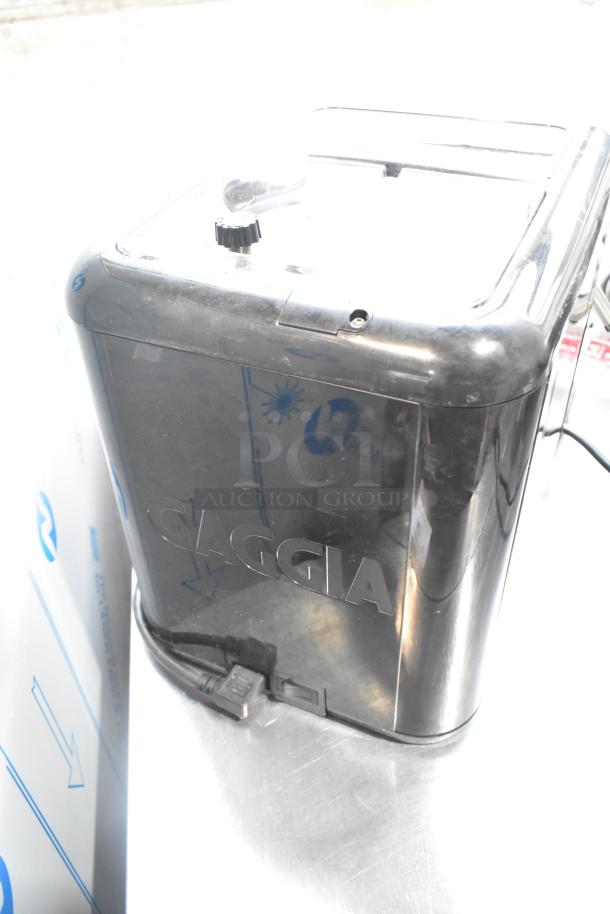 Gaggia Brera black countertop super-automatic espresso machine, 115 volts, features Gaggia logo, in used condition.
