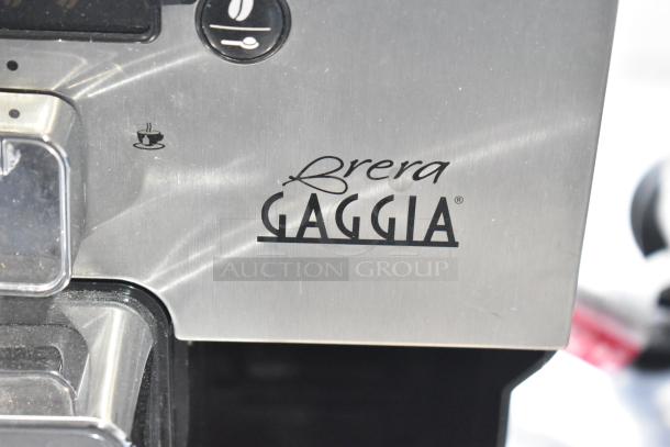 Gaggia Brera Super-Automatic Espresso Machine with brushed metal finish, featuring logo and control icons. Model: 115 Volts, 1 Phase.