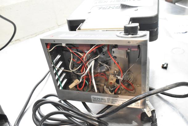 Sephra SERTWFL01 Countertop Waffle Baker System, interior wiring exposed. Model and voltage details visible on label.