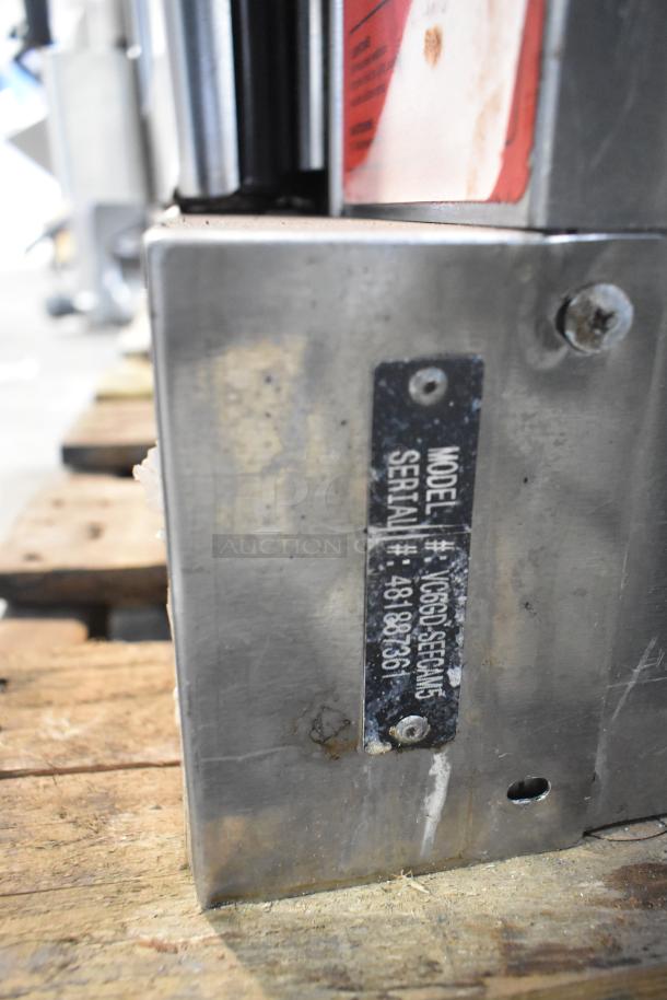 Vulcan VC5ED-SEFCAM5 commercial convection oven, view-through doors, thermostatic controls, metal label with model and serial number.