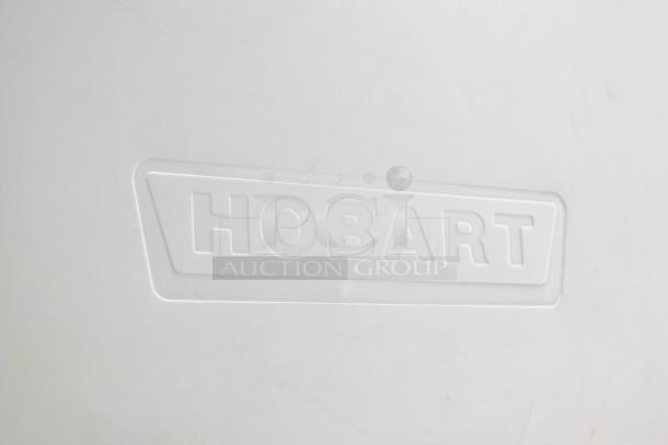 Hobart 6801 Commercial Meat Saw, 200-230V, 3 Phase, floor style, featuring embossed Hobart logo. Ideal for professional use.