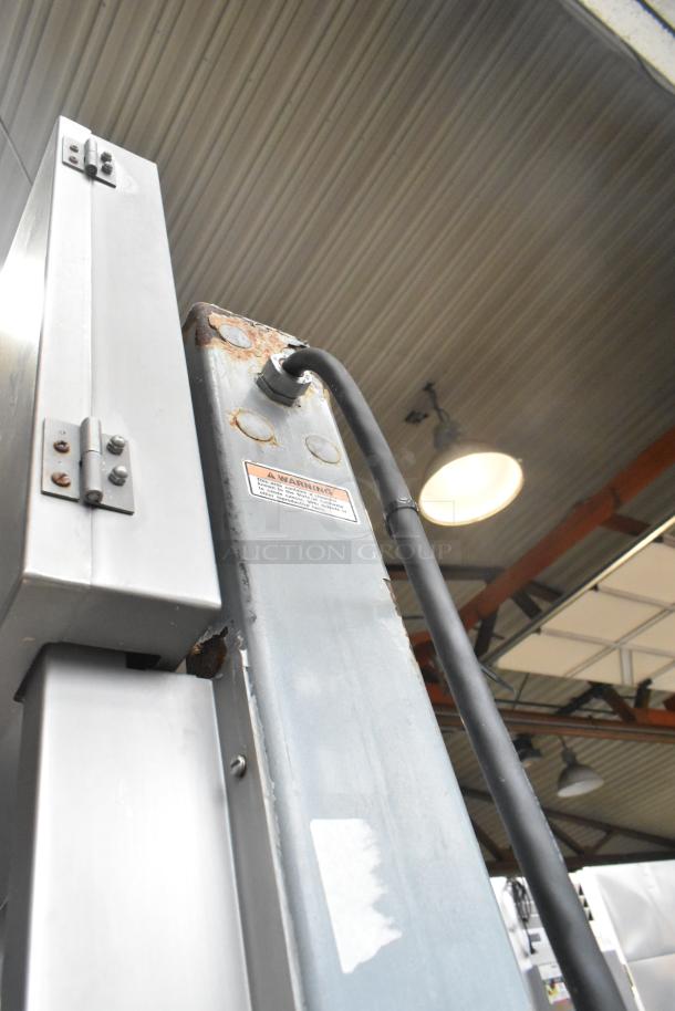 Hobart 6801 commercial meat saw, floor style, 200-230 volts, 3 phase, visible wear, warning label on side.