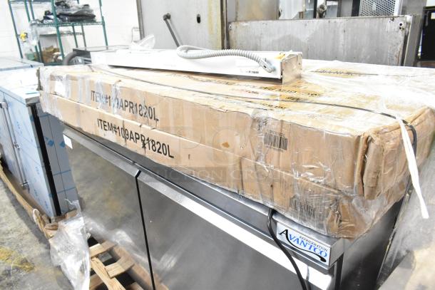 2 brand new Regency 20-pan end load sheet pan racks in unassembled boxes, scratch and dent condition, non-marking casters.