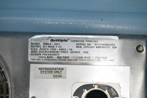 Delfield 406CA-DD1 undercounter cooler label, 115V, serial 0711152001331, R-404A refrigerant, 7 oz, 1 phase.