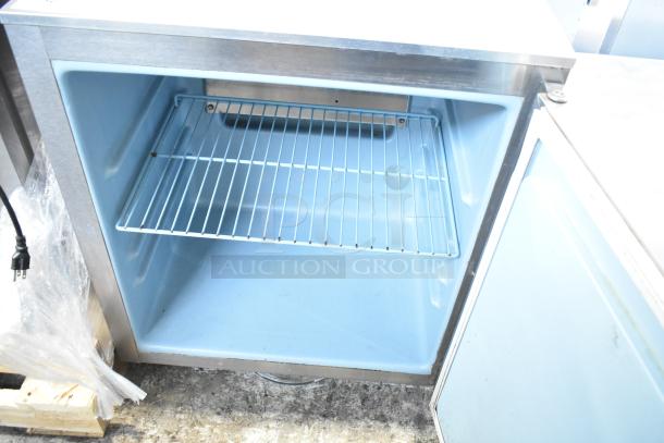 Delfield 406CA-DD1 undercounter cooler, single door, 115 volts, stainless steel exterior, clean interior, shelf included.