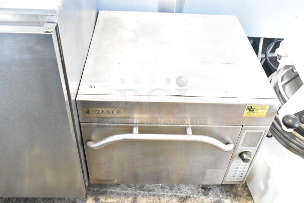 Amana AXP20 commercial countertop oven, 208/230 volts, 1 phase, showing signs of use, labeled "Loaner," control panel visible.