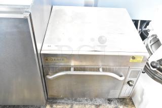 Amana AXP20 commercial countertop oven, 208/230 volts, 1 phase, showing signs of use, labeled "Loaner," control panel visible.