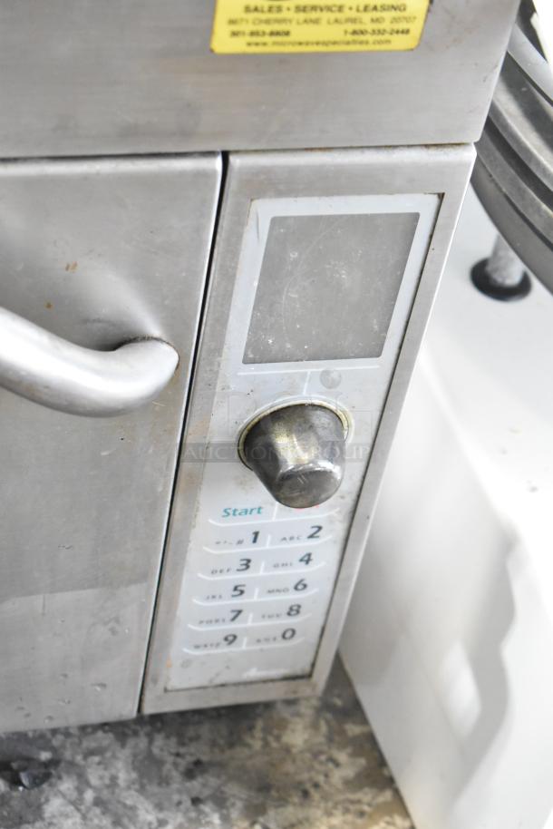 Amana AXP20 commercial countertop oven, control panel view; shows numeric keypad and selection knob. 208/230V, 1 phase.