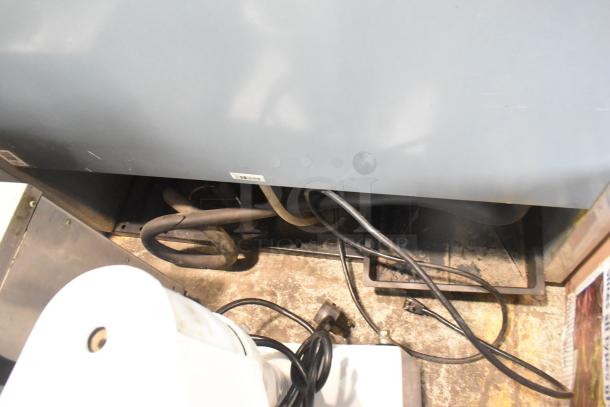 2019 True T-35 Commercial 2 Door Reach In Cooler, visible wiring at the back, 115 volts, 1 phase, model T-35.