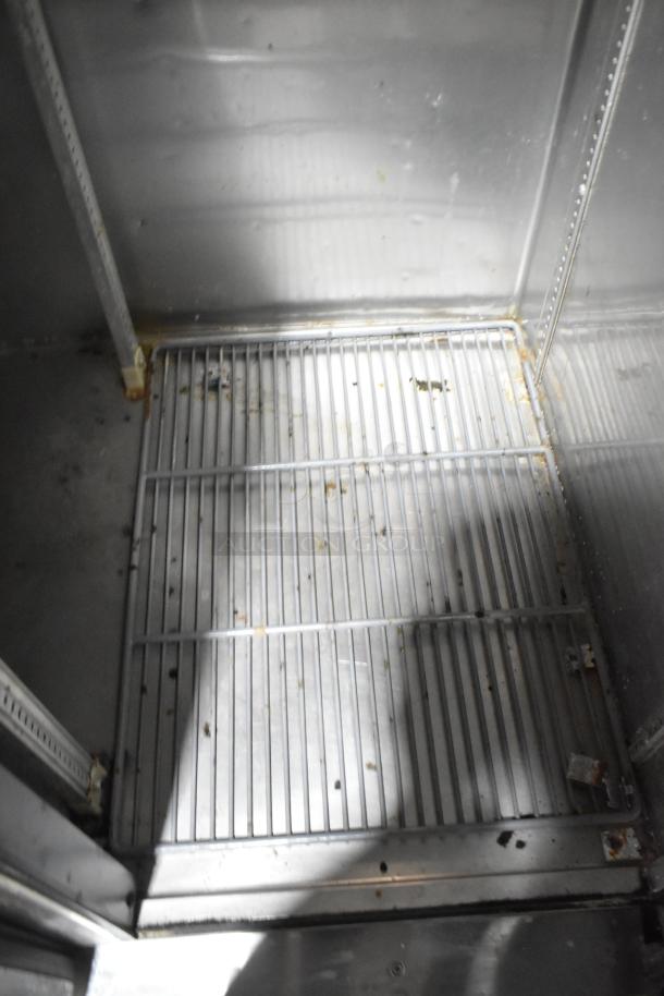 2019 True T-35 commercial cooler interior. Two-door reach-in, 115 volts, 1 phase, in used condition with visible wear.
