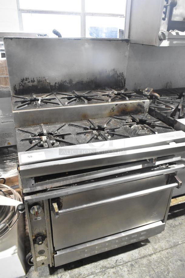 Jade Range commercial gas-powered 6 burner, 2-tier range with oven, backsplash, and commercial casters, used condition.