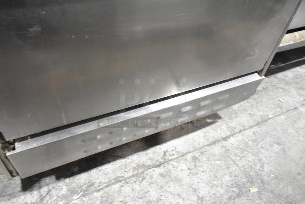 Jade Range commercial gas-powered, 6-burner, 2-tier range with oven, backsplash, and casters. Good condition, logo visible.