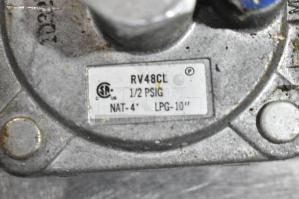 Label close-up on Southbend commercial range, model RV48CL, showing gas pressure ratings: 1/2 PSIG, NAT-4", LPG-10".