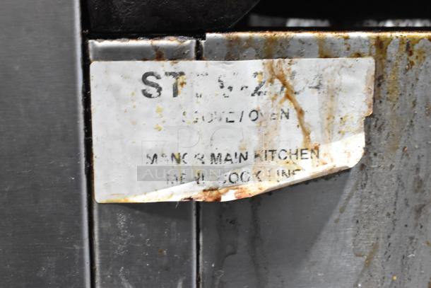 Southbend commercial 6-burner gas range with oven, salamander cheese melter, backsplash, worn condition, visible label.