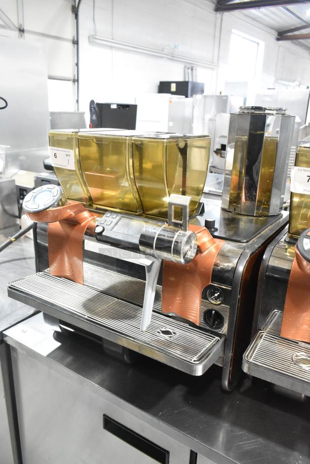 Thermoplan Mastrena Super Automatic Espresso Machine, 250V, commercial countertop model, good condition, with digital controls.