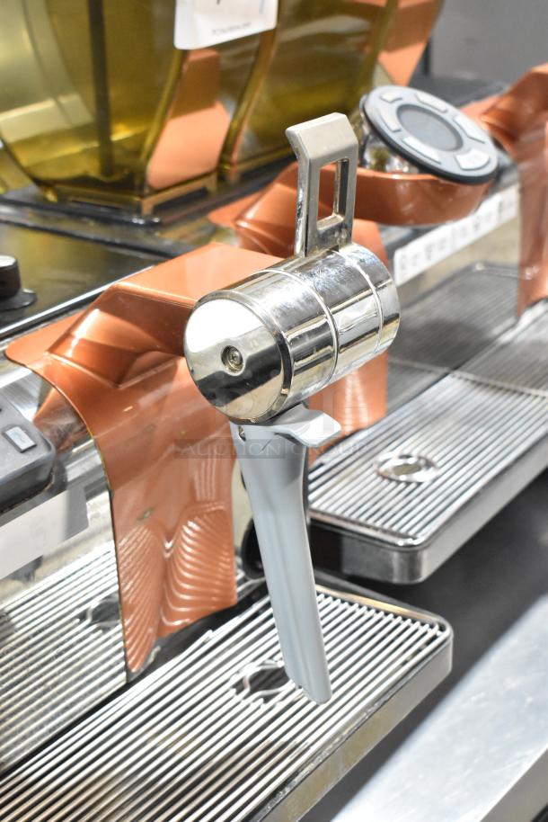 Thermoplan Mastrena super automatic espresso machine, 250V, stainless with copper accents, commercial-grade condition.