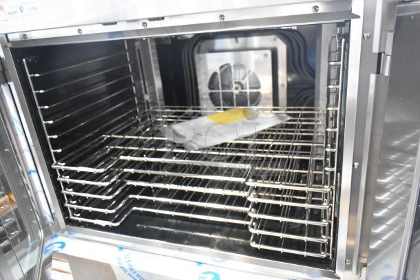 Brand new 2025 Vulcan VC5ED-11D1Z commercial convection oven, view-through doors, thermostatic controls, metal legs.