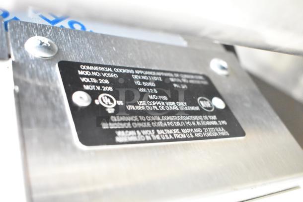 Close-up of the Vulcan VC5ED-11D1Z oven label, showing model number, voltage (208V), and UL certification markings.