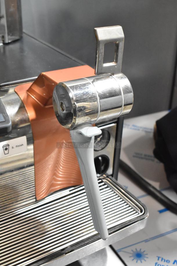 Thermoplan Mastrena espresso machine, commercial-grade, super automatic, 250V, features metallic finish, cup graphic label.