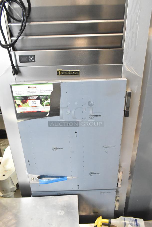 Brand new 2022 Traulsen G10042-032 cooler, 2 half doors, pass-through design, scratch and dent, commercial casters, 115V.