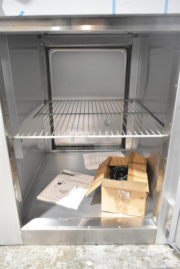 Brand new 2022 Traulsen G10042-032 cooler with 2 half doors, includes commercial casters, 115V, 1 phase, scratch and dent condition.