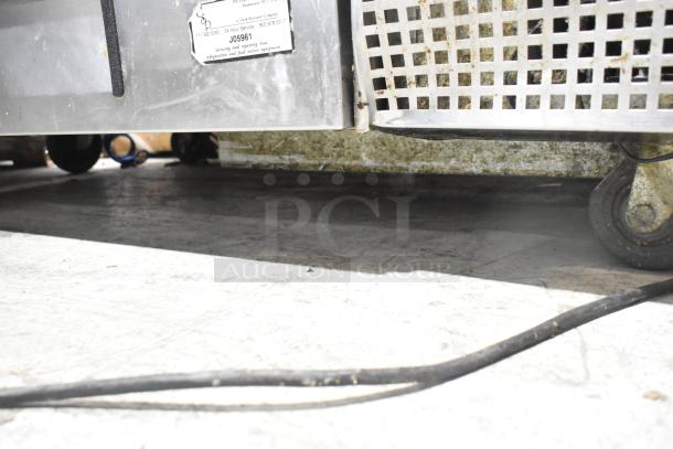 Commercial 2 Drawer Chef Base with casters, 115 Volts, 1 Phase. Visible label shows service information.