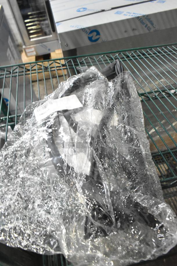 Bundle of 15 scratch and dent items, mainly gaskets, sealed in plastic. Tags indicate new condition with minor imperfections.