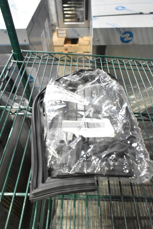 Bundle of 15 brand new scratch and dent gaskets, in packaging with barcode labels, on a metal shelf.