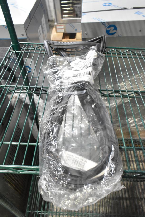 Package of brand new gaskets in plastic wrap, barcode visible, part of a 15-item scratch and dent auction lot.