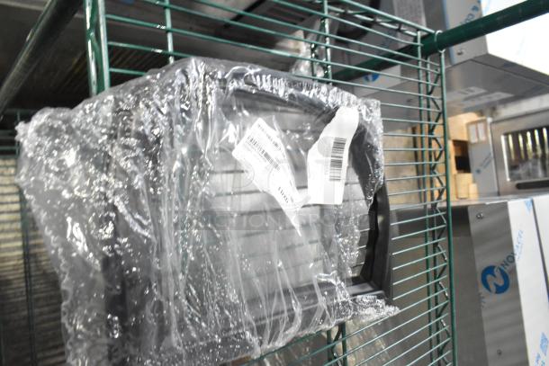 15 brand new assorted scratch and dent items wrapped in plastic on a metal shelf, tags visible. Includes gaskets.