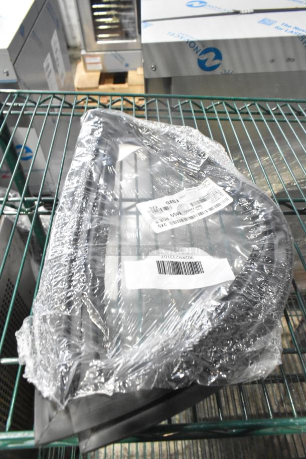 Plastic-wrapped gaskets on a metal shelf, labeled with barcodes and item codes. New condition, part of a scratch and dent auction.