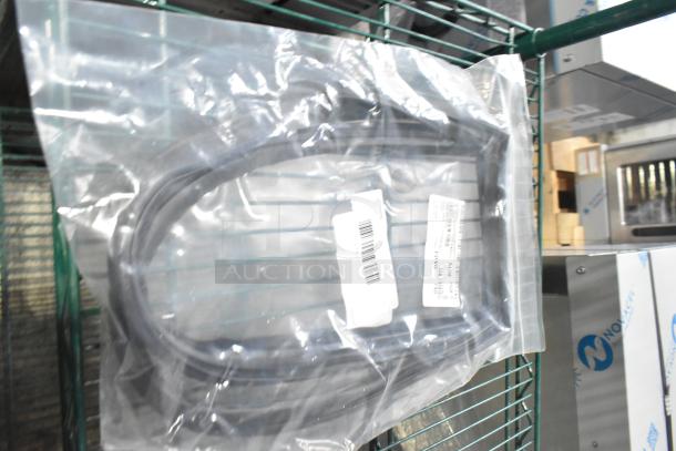 Plastic-wrapped gaskets with visible barcode labels, part of a lot of 15 new scratch and dent items for auction.