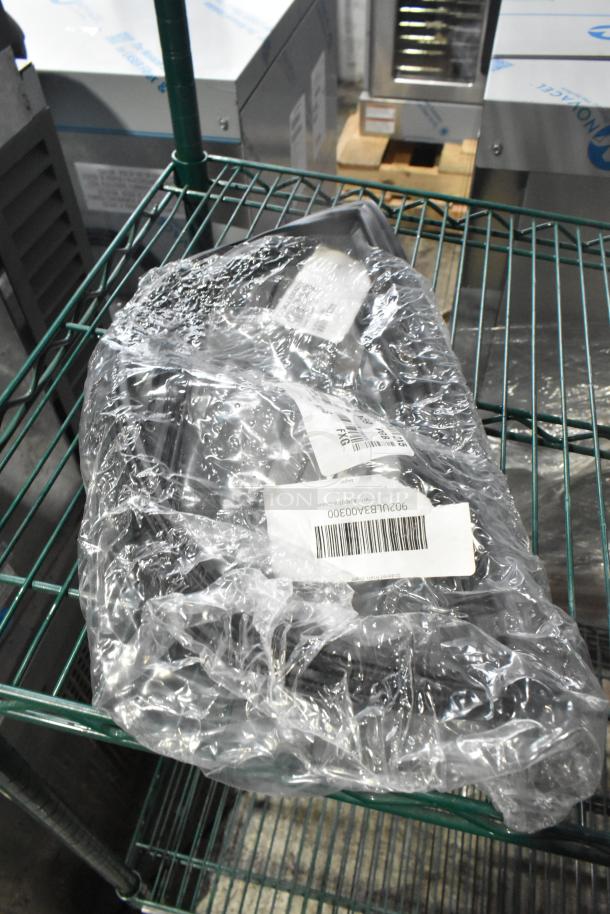 Plastic-wrapped bundle of new scratch-and-dent gaskets on a metal shelf, with visible barcode and product labels.