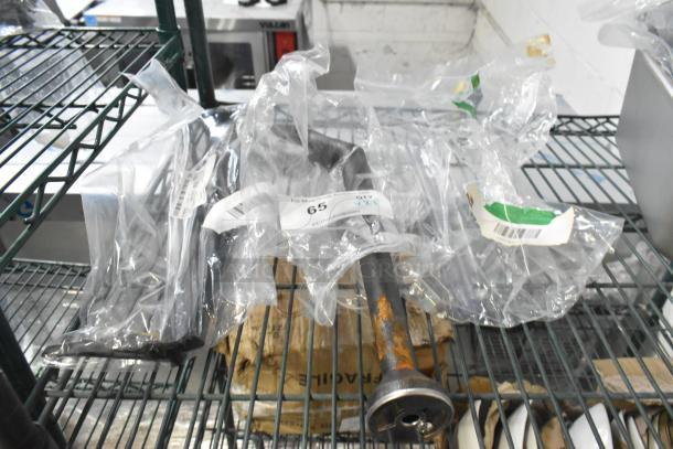 Brand new scratch and dent items on shelf, including Continental Refrigerator CM6-0907 Evaporator Drain Pan, Imperial 38052 Burner, Turbo Air 30226L0101 Door Handle. Each item bagged with visible tags.